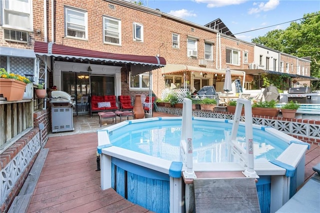 2472 Stuart St, Brooklyn, NY 11229 - view of pool featuring area for grilling and a wooden deck