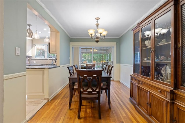 2472 Stuart St, Brooklyn, NY 11229 - dining area featuring a chandelier, light wood-style flooring, and crown molding