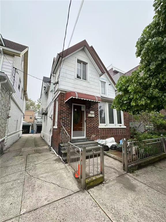 1620 68th St, Brooklyn, NY 11204 - view of front of house with brick siding and concrete driveway