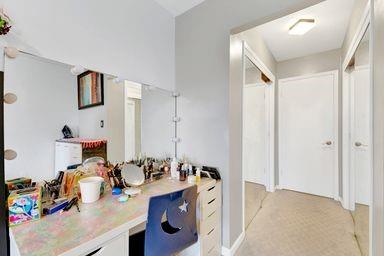 corridor featuring a desk