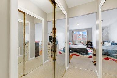 hallway featuring french doors and carpet