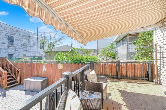 deck with fence and stairs