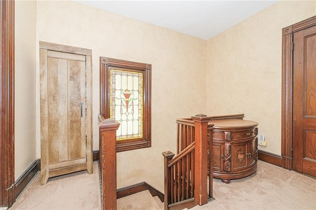 staircase with carpet flooring and baseboards
