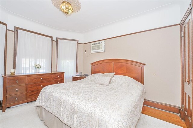 bedroom with a wall mounted AC