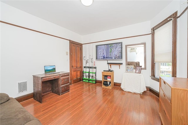 office with wood finished floors and baseboards