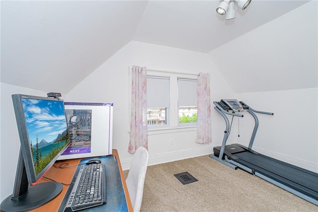 exercise area with lofted ceiling, baseboards, and carpet floors