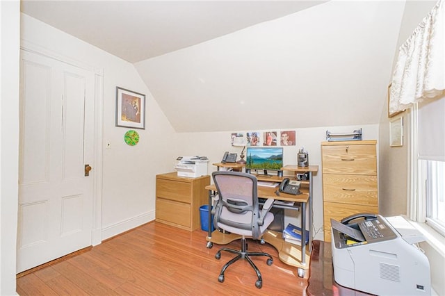 office with wood finished floors, lofted ceiling, and baseboards