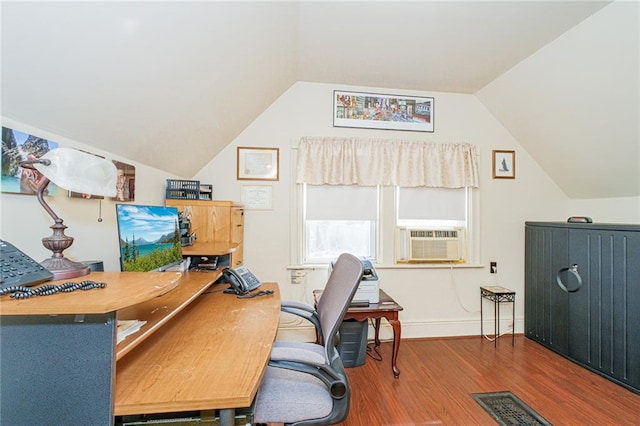 office featuring cooling unit, wood finished floors, vaulted ceiling, and baseboards