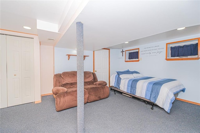 carpeted bedroom featuring baseboards and recessed lighting
