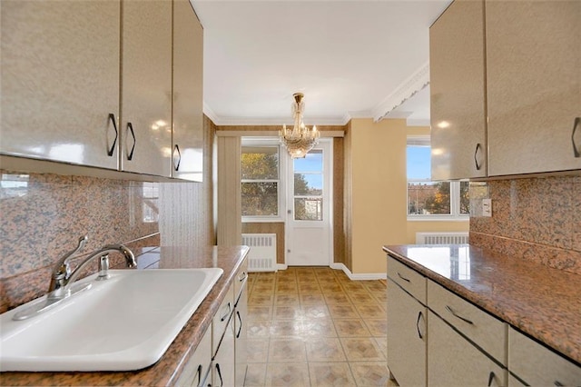 2483 W 16th St Unit 4B, Brooklyn, NY 11214 - kitchen featuring a sink, decorative backsplash, a chandelier, radiator heating unit, and ornamental molding
