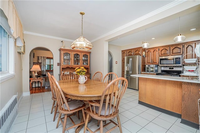 1413 81st St, Brooklyn, NY 11228 - dining area featuring arched walkways, radiator, light tile patterned floors, and ornamental molding