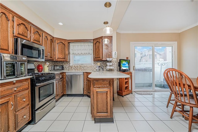 1413 81st St, Brooklyn, NY 11228 - kitchen featuring stainless steel appliances, a peninsula, backsplash, brown cabinetry, and healthy amount of natural light