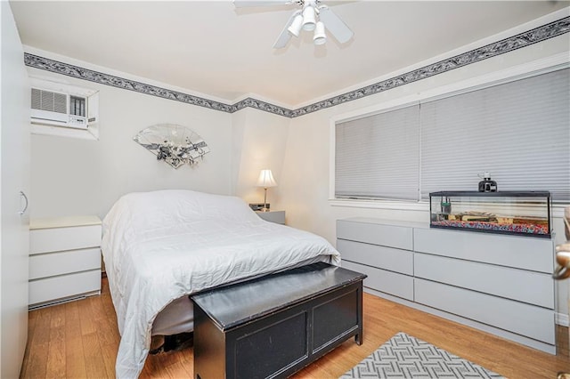 1413 81st St, Brooklyn, NY 11228 - bedroom with an AC wall unit, wood finished floors, and a ceiling fan