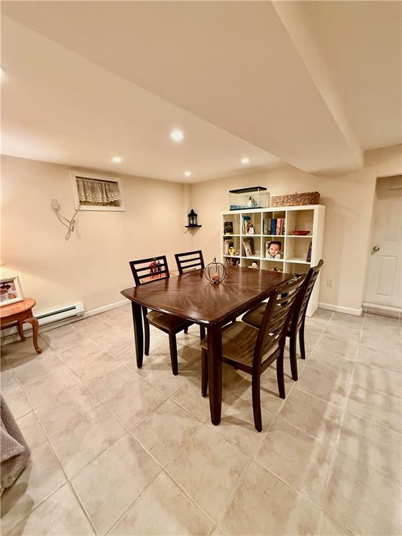 1413 81st St, Brooklyn, NY 11228 - dining area featuring recessed lighting, a baseboard heating unit, light tile patterned flooring, and a wall unit AC