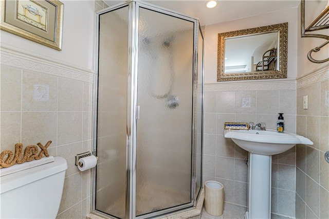 1413 81st St, Brooklyn, NY 11228 - full bathroom featuring tile walls, a stall shower, and a wainscoted wall