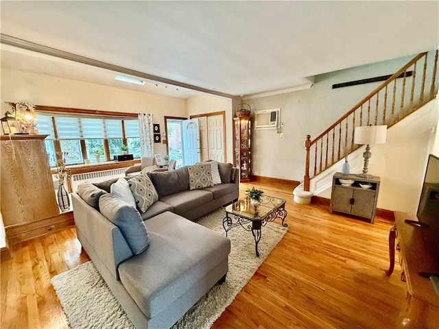 1413 81st St, Brooklyn, NY 11228 - living area featuring stairs, wood finished floors, an AC wall unit, and radiator heating unit