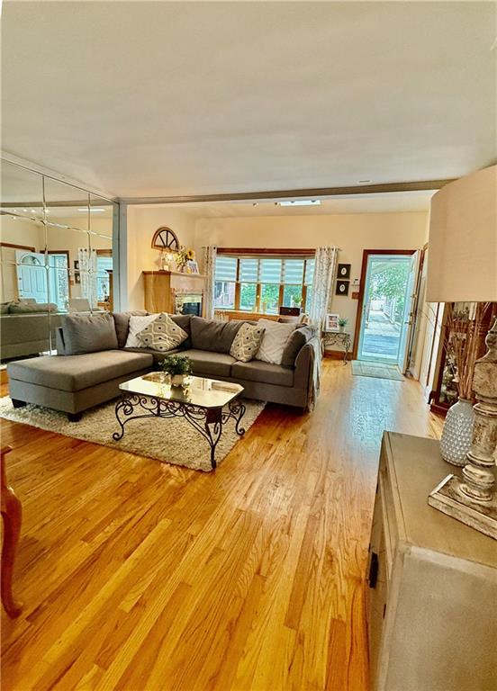 1413 81st St, Brooklyn, NY 11228 - living area featuring light wood-style floors and a fireplace