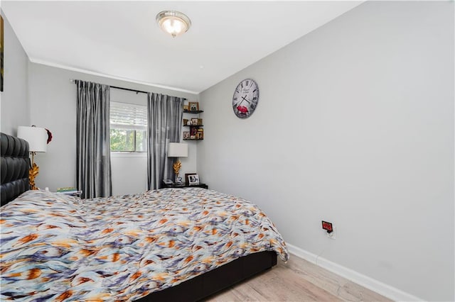 131 Stonegate Dr Unit 1, Staten Island, NY 10304 - bedroom with light wood-type flooring and baseboards