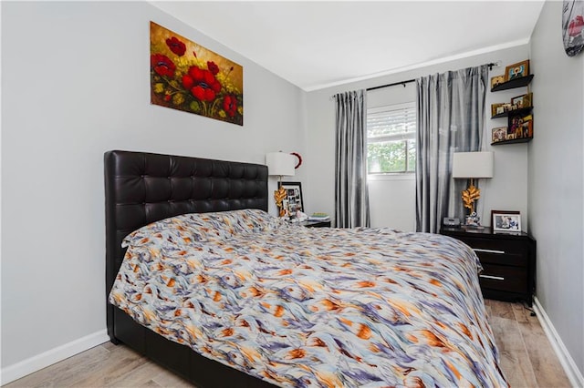 131 Stonegate Dr Unit 1, Staten Island, NY 10304 - bedroom with light wood-style flooring, baseboards, and ornamental molding