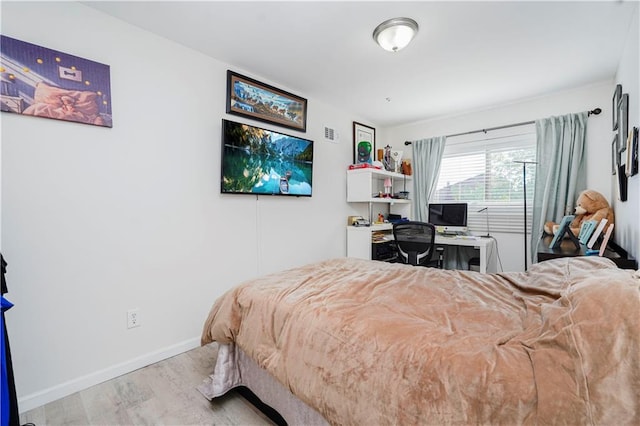 131 Stonegate Dr Unit 1, Staten Island, NY 10304 - bedroom featuring wood finished floors, an office area, and baseboards