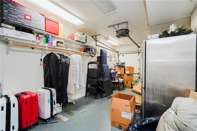 131 Stonegate Dr Unit 1, Staten Island, NY 10304 - garage with a garage door opener and freestanding refrigerator