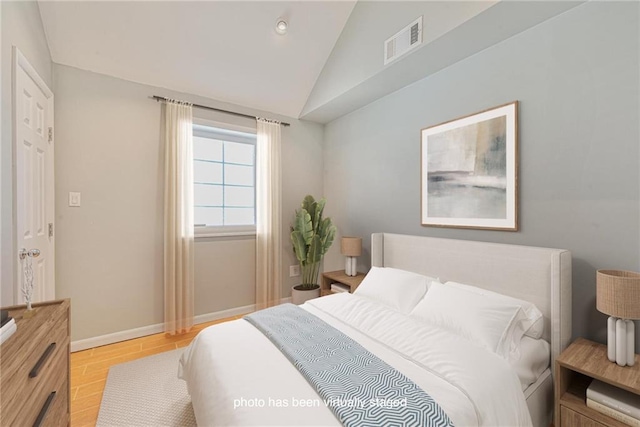 bedroom featuring vaulted ceiling, baseboards, light wood finished floors, and recessed lighting