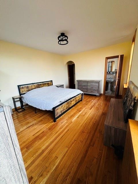 1900 Quentin Rd Unit F4, Brooklyn, NY 11229 - bedroom with wood finished floors and arched walkways