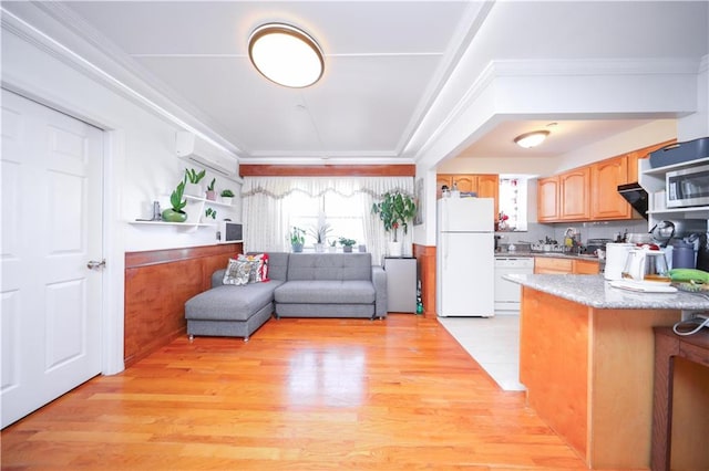 1820 73rd St Unit 3A, Brooklyn, NY 11204 - kitchen with white appliances, light wood-style floors, a wall mounted air conditioner, crown molding, and wainscoting