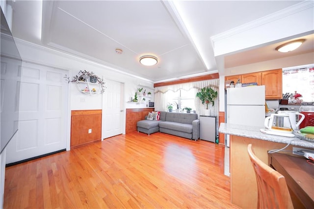 1820 73rd St Unit 3A, Brooklyn, NY 11204 - living area with light wood-style flooring and a wainscoted wall