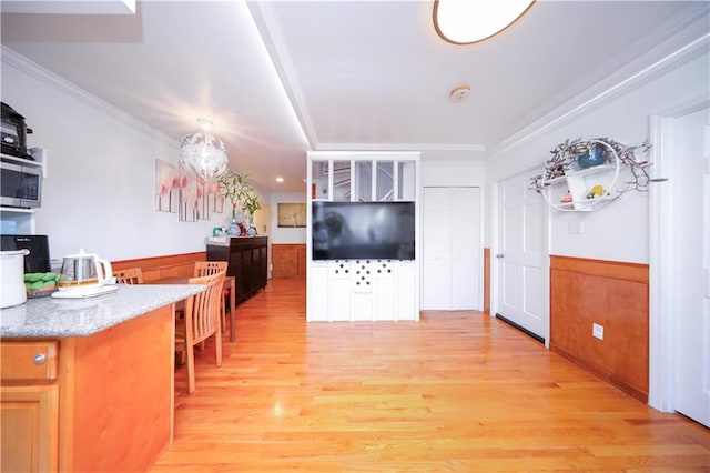 1820 73rd St Unit 3A, Brooklyn, NY 11204 - living room with wainscoting, light wood-type flooring, and ornamental molding