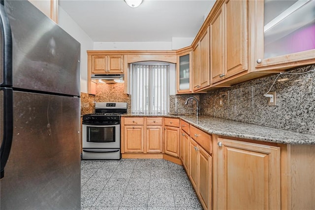 1519 71st St, Brooklyn, NY 11228 - kitchen with appliances with stainless steel finishes, a sink, light stone countertops, backsplash, and glass insert cabinets