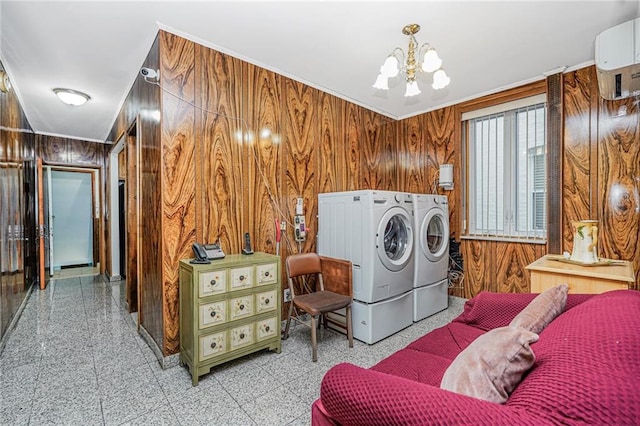 1519 71st St, Brooklyn, NY 11228 - laundry room with washer and dryer, wooden walls, a chandelier, granite tiled floors, and a wall mounted air conditioner