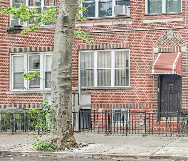 1519 71st St, Brooklyn, NY 11228 - view of exterior entry with brick siding and cooling unit
