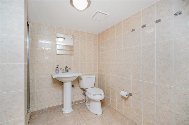 1519 71st St, Brooklyn, NY 11228 - bathroom with toilet, a shower stall, tile patterned floors, and a sink