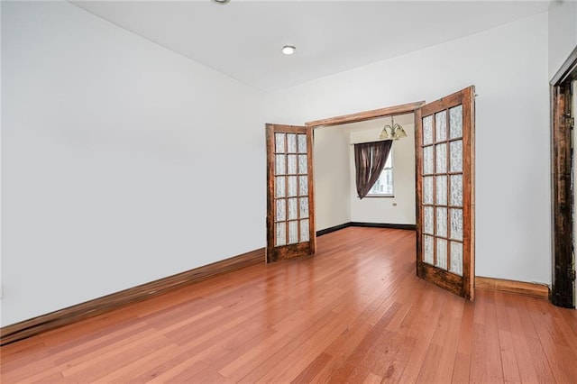 1519 71st St, Brooklyn, NY 11228 - unfurnished room with french doors, baseboards, and light wood-style floors