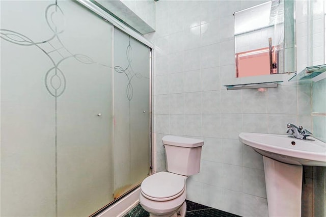 1519 71st St, Brooklyn, NY 11228 - bathroom featuring tile walls, toilet, a stall shower, and a sink
