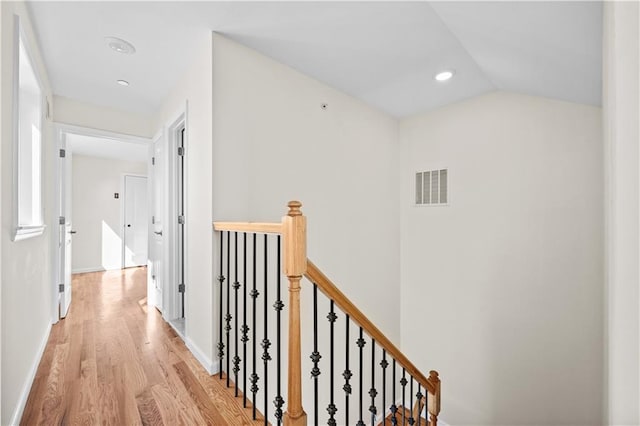 91 Robin Rd, Staten Island, NY 10305 - corridor with an upstairs landing, light wood-style flooring, baseboards, vaulted ceiling, and recessed lighting