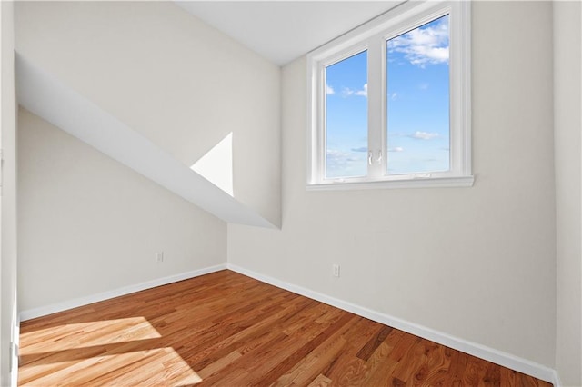 91 Robin Rd, Staten Island, NY 10305 - additional living space featuring baseboards, wood finished floors, and lofted ceiling