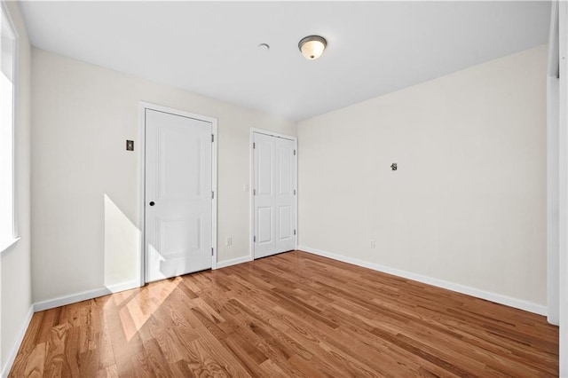 91 Robin Rd, Staten Island, NY 10305 - unfurnished bedroom featuring wood finished floors and baseboards