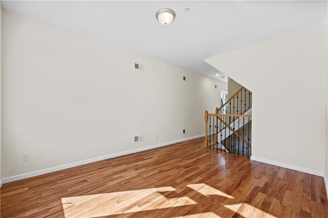 91 Robin Rd, Staten Island, NY 10305 - empty room with baseboards, wood finished floors, and stairs