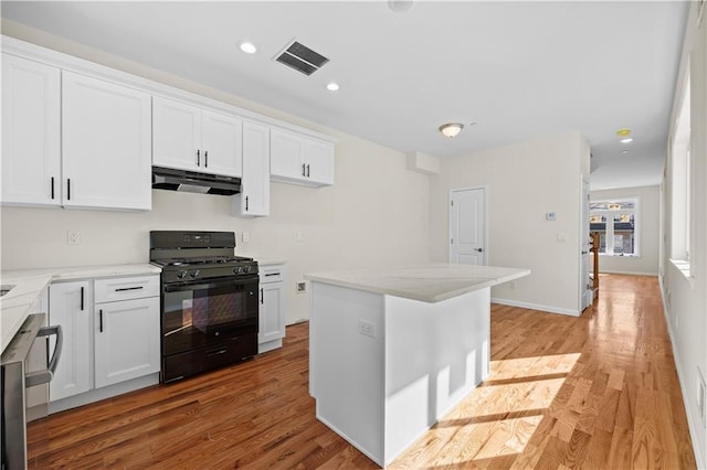 91 Robin Rd, Staten Island, NY 10305 - kitchen featuring black range with gas stovetop, under cabinet range hood, white cabinetry, light stone counters, and recessed lighting