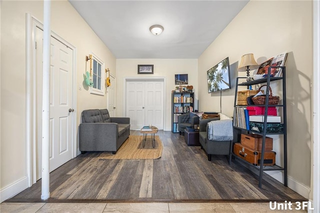 sitting room with wood finished floors and baseboards