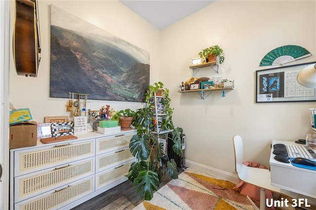 detailed view of baseboards and a desk