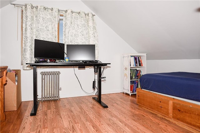 2064 Coleman St, Brooklyn, NY 11234 - bedroom featuring radiator, wood finished floors, and vaulted ceiling