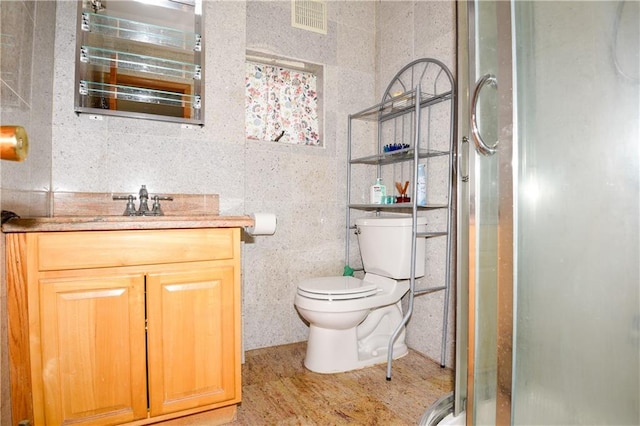 2064 Coleman St, Brooklyn, NY 11234 - full bathroom featuring vanity, a shower stall, tile walls, and toilet