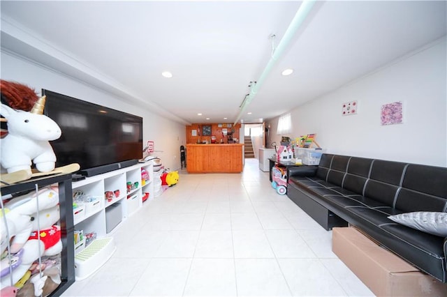 living room with recessed lighting, light tile patterned floors, and bar area
