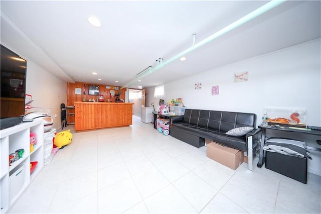 living area with recessed lighting and light tile patterned floors