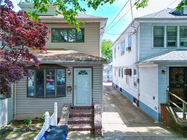 2039 Batchelder St, Brooklyn, NY 11229 - view of front facade featuring entry steps and a shingled roof
