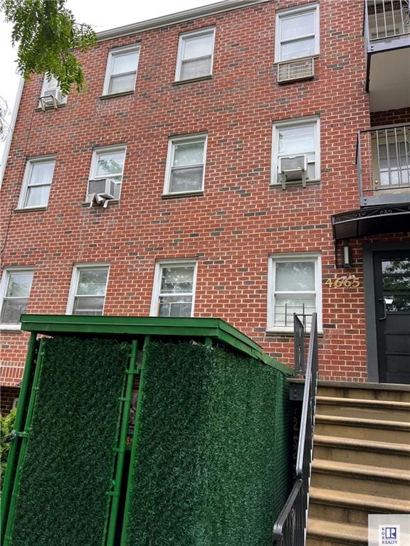 view of apartment building / complex with cooling unit