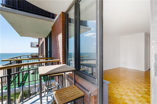 balcony featuring a water view